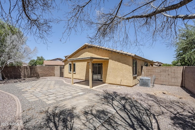 16159 W Maui Ln, Surprise, AZ 85379 - back of house with stucco siding, central air condition unit, a fenced backyard, and a patio area