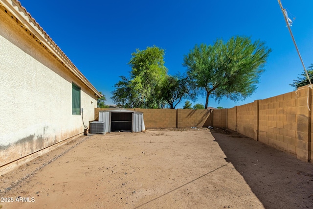5654 W Vineyard Rd, Laveen, AZ 85339 - fenced backyard featuring a storage unit