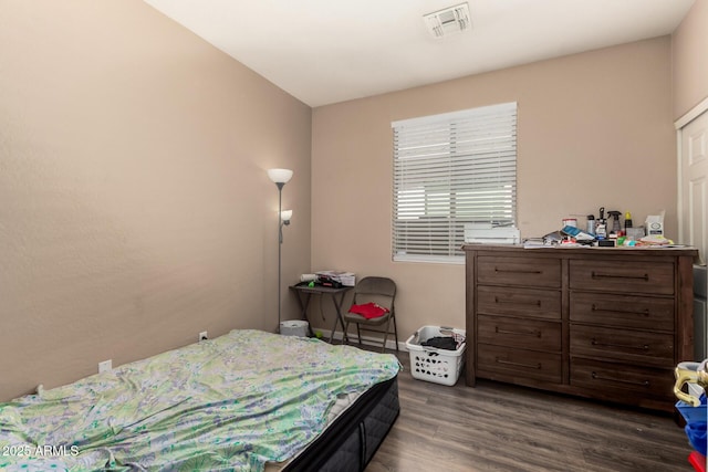 5654 W Vineyard Rd, Laveen, AZ 85339 - bedroom with dark wood-style floors