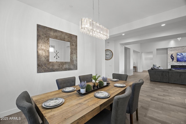 dining space with a chandelier and hardwood / wood-style floors