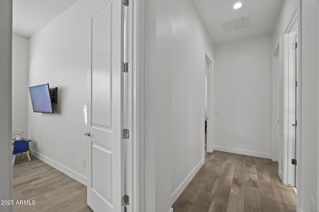 corridor with light wood-type flooring