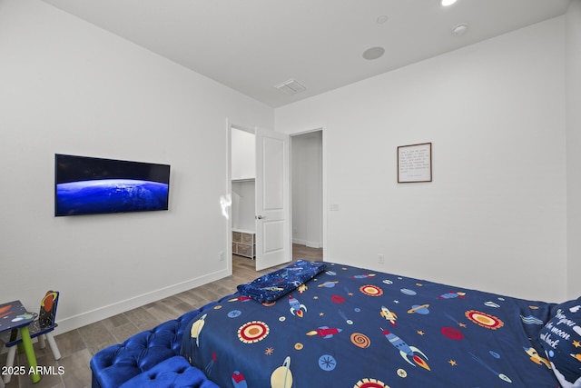 bedroom featuring wood-type flooring