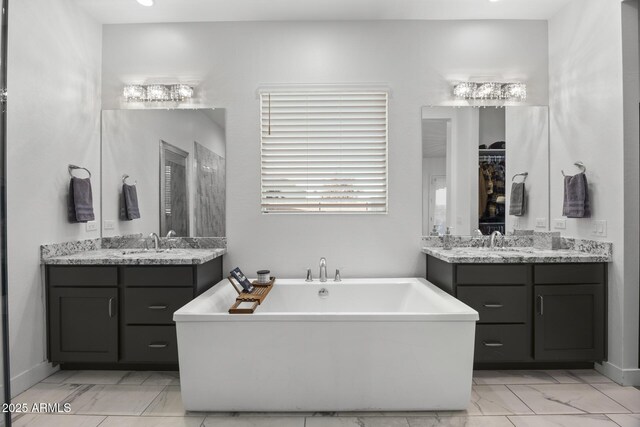 bathroom featuring vanity and a bathing tub