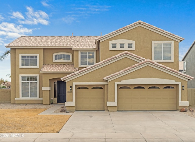 mediterranean / spanish-style home with a garage