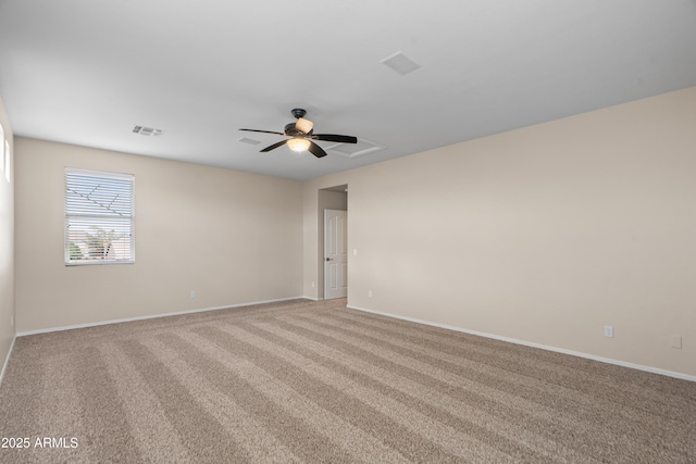 carpeted empty room featuring ceiling fan