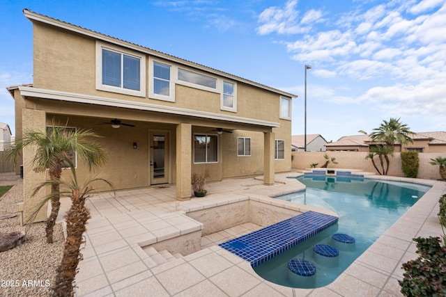 view of pool with a patio area and ceiling fan