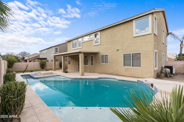 view of pool with a patio and a hot tub