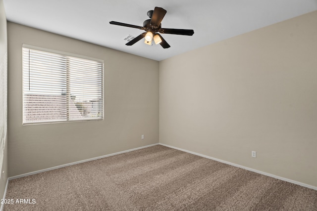 carpeted empty room with ceiling fan