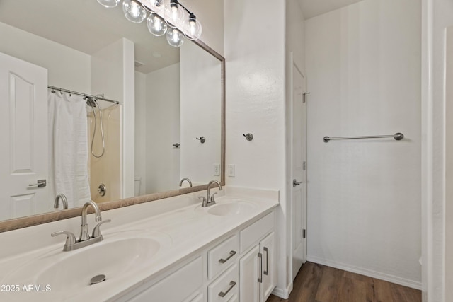 bathroom featuring vanity, hardwood / wood-style flooring, and a shower with shower curtain