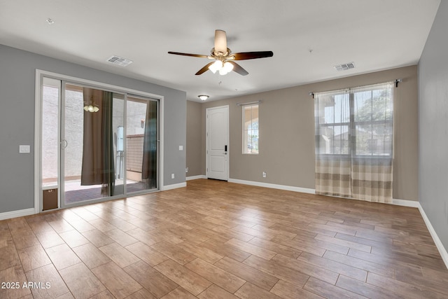 3036 N Acacia Way, Buckeye, AZ 85396 - unfurnished room featuring a ceiling fan and wood finished floors