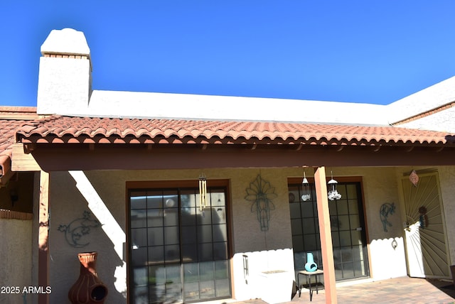 rear view of property featuring a porch