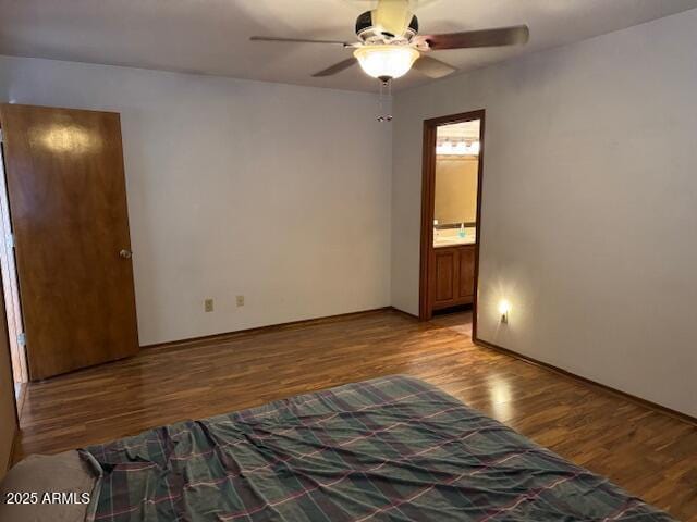 empty room with ceiling fan and wood-type flooring