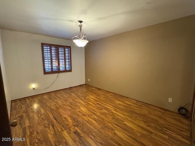 spare room featuring hardwood / wood-style floors