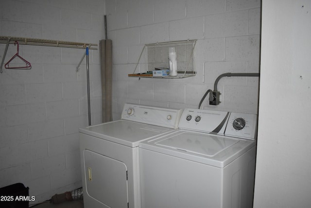 washroom featuring washer and clothes dryer