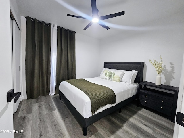 bedroom with ceiling fan and wood finished floors