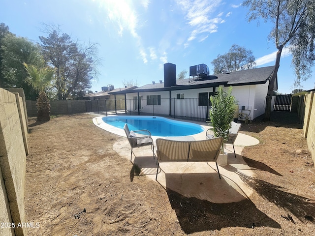 view of pool with a patio, a fenced backyard, and a fenced in pool