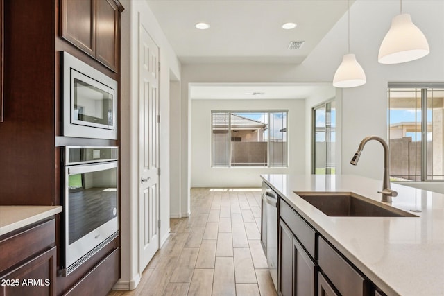 22987 E Pummelos Rd, Queen Creek, AZ 85142 - kitchen with plenty of natural light, visible vents, a sink, and appliances with stainless steel finishes