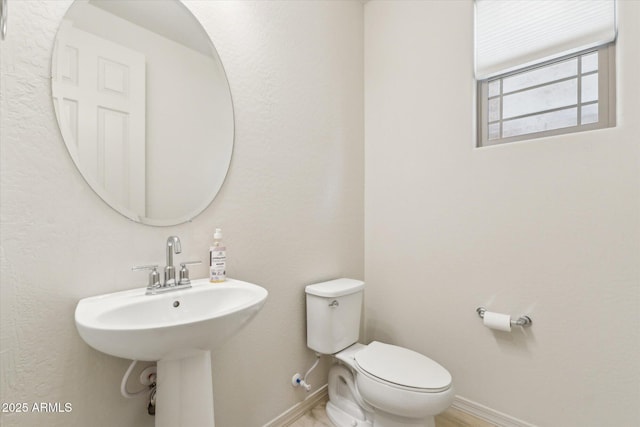 22987 E Pummelos Rd, Queen Creek, AZ 85142 - bathroom featuring toilet and baseboards