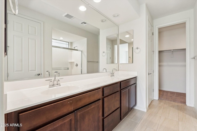 22987 E Pummelos Rd, Queen Creek, AZ 85142 - full bath featuring a shower stall, visible vents, and a sink