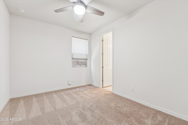 22987 E Pummelos Rd, Queen Creek, AZ 85142 - unfurnished room featuring light carpet, ceiling fan, and baseboards