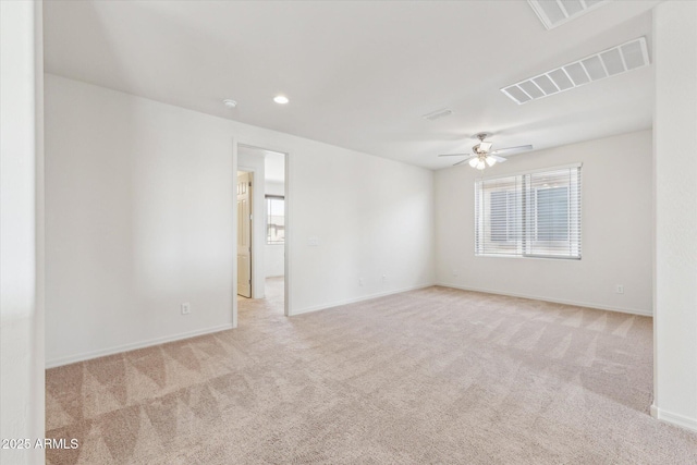 22987 E Pummelos Rd, Queen Creek, AZ 85142 - empty room featuring light carpet, visible vents, baseboards, and ceiling fan