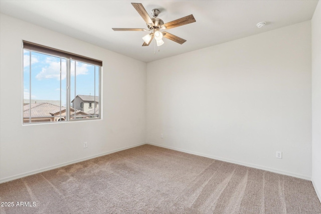 22987 E Pummelos Rd, Queen Creek, AZ 85142 - carpeted spare room with baseboards and a ceiling fan