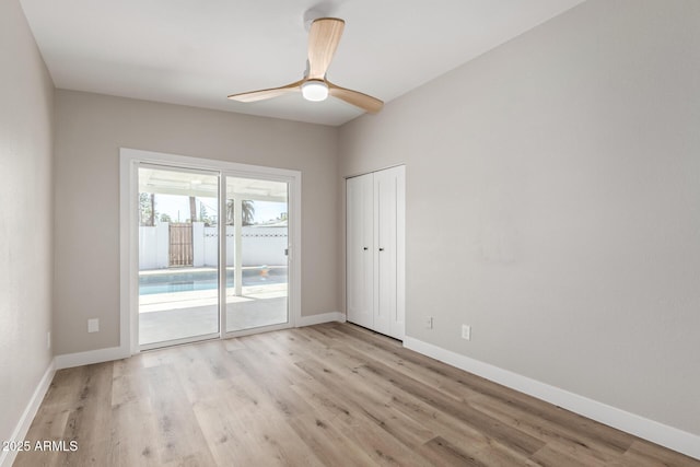1920 N Cavalier Dr, Tempe, AZ 85288 - empty room featuring light wood finished floors, baseboards, and a ceiling fan