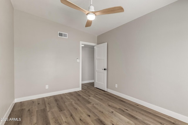 1920 N Cavalier Dr, Tempe, AZ 85288 - unfurnished room featuring wood finished floors, baseboards, and ceiling fan