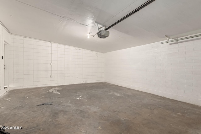 1920 N Cavalier Dr, Tempe, AZ 85288 - garage with a garage door opener and concrete block wall