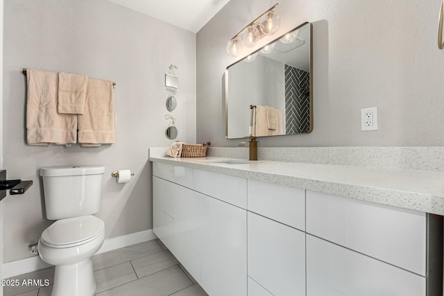 1920 N Cavalier Dr, Tempe, AZ 85288 - bathroom with baseboards, toilet, and vanity