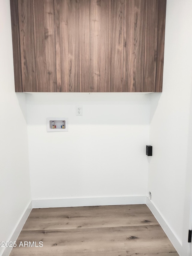 1920 N Cavalier Dr, Tempe, AZ 85288 - laundry room with cabinet space, washer hookup, baseboards, and wood finished floors