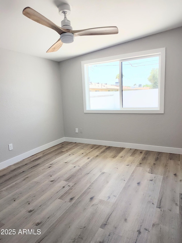 1920 N Cavalier Dr, Tempe, AZ 85288 - unfurnished room with wood finished floors, a ceiling fan, and baseboards
