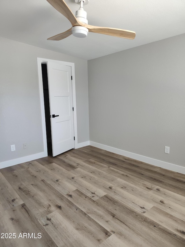 1920 N Cavalier Dr, Tempe, AZ 85288 - unfurnished room with ceiling fan, wood finished floors, and baseboards
