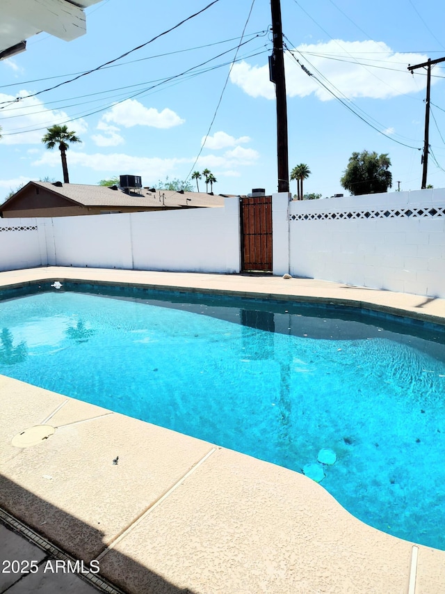 1920 N Cavalier Dr, Tempe, AZ 85288 - view of swimming pool with a fenced backyard and a gate