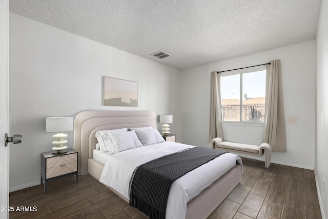 bedroom featuring a textured ceiling