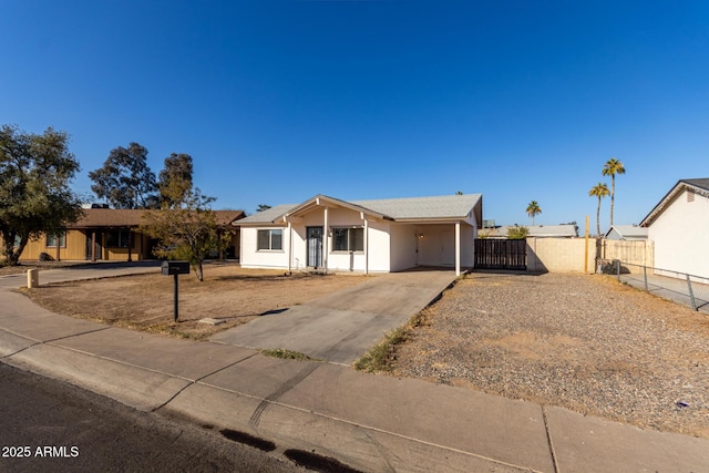 ranch-style home with a carport