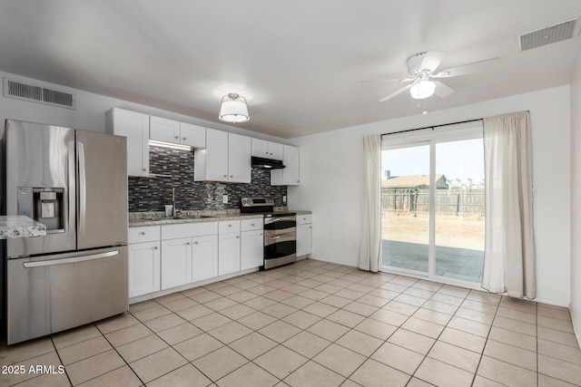 kitchen with white cabinetry, appliances with stainless steel finishes, sink, and light tile patterned floors