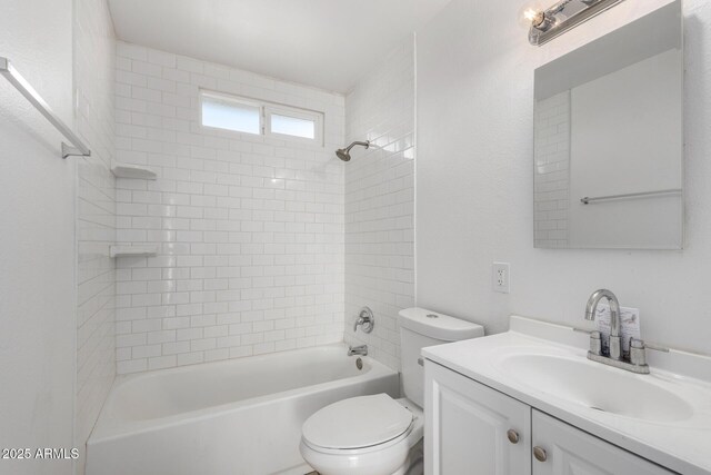 full bathroom featuring vanity, toilet, and tiled shower / bath