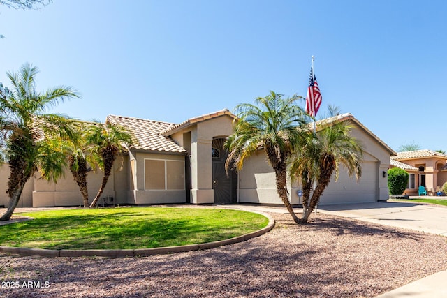 view of front of house featuring a garage, stucco siding, a front lawn, a tile roof, and driveway