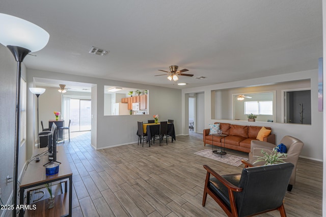 living room with ceiling fan