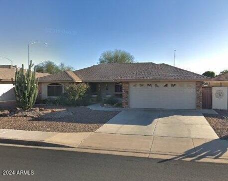 ranch-style home with a garage