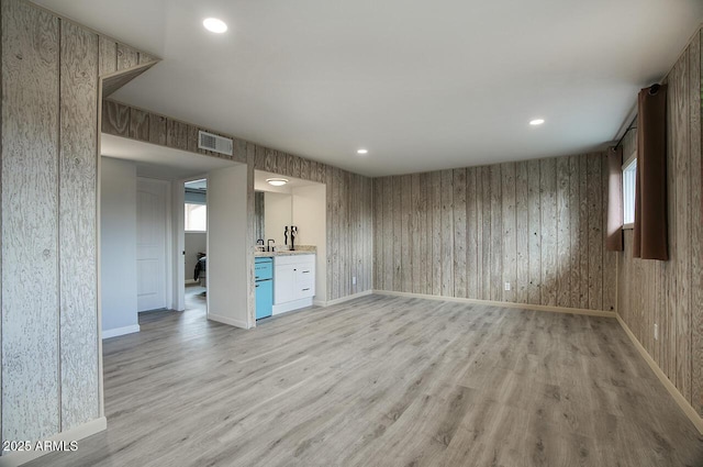 unfurnished living room featuring light wood-type flooring