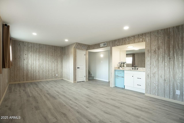 interior space featuring sink and light wood-type flooring