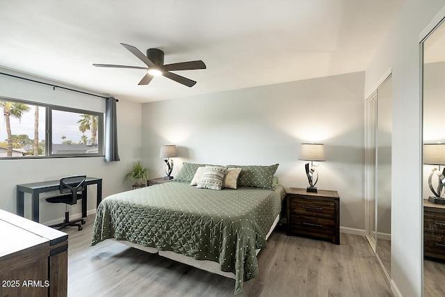 bedroom featuring ceiling fan and light hardwood / wood-style flooring