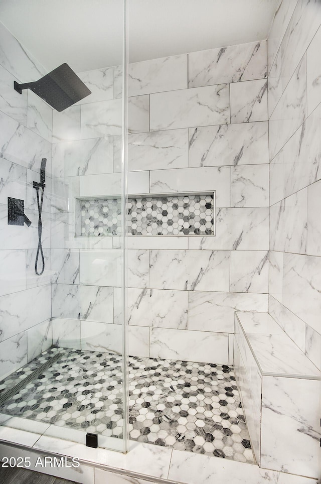 bathroom featuring tiled shower