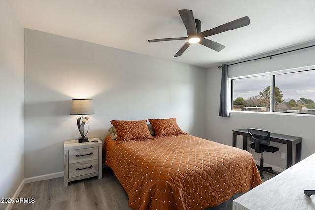 bedroom featuring dark hardwood / wood-style floors and ceiling fan