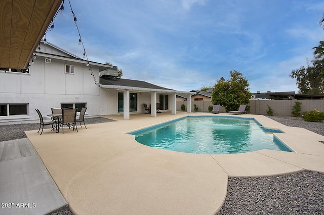 view of swimming pool with a patio and pool water feature