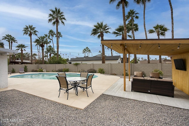 view of swimming pool featuring an outdoor living space and a patio