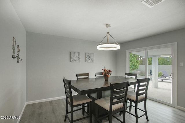 dining space featuring hardwood / wood-style flooring