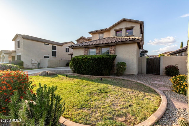 21472 E Saddle Ct, Queen Creek, AZ 85142 - rear view of property with stucco siding, a tiled roof, and a gate